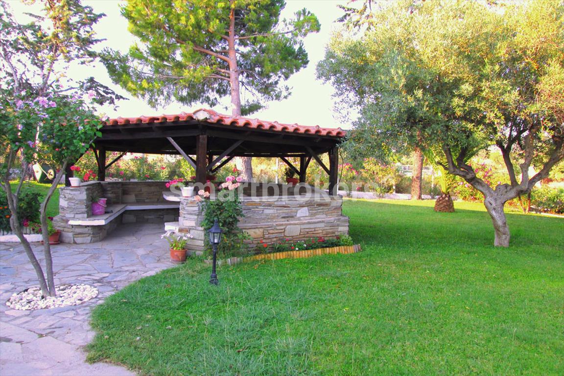 A large house built on 3 floors with a beautifully maintained yard and gazebo in Sithonia